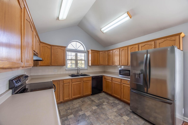 kitchen with brown cabinetry, stainless steel appliances, light countertops, under cabinet range hood, and a sink