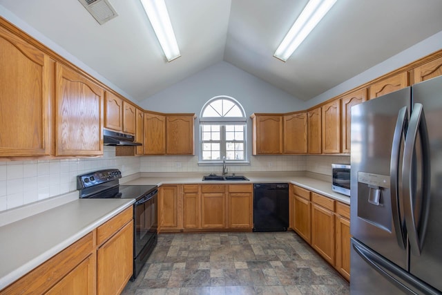 kitchen with under cabinet range hood, a sink, light countertops, black appliances, and brown cabinetry