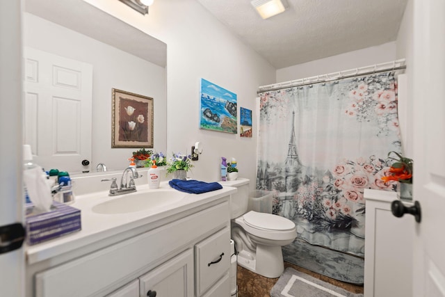 full bathroom with toilet, a shower with curtain, a textured ceiling, and vanity