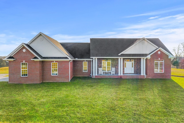 view of front of house with brick siding and a front lawn