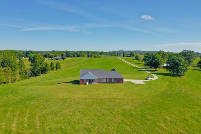 birds eye view of property with a rural view