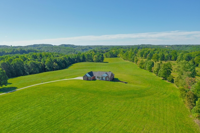 bird's eye view featuring a wooded view