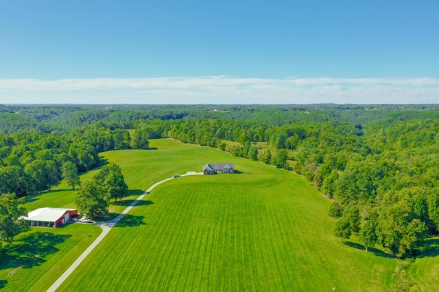 bird's eye view with a wooded view