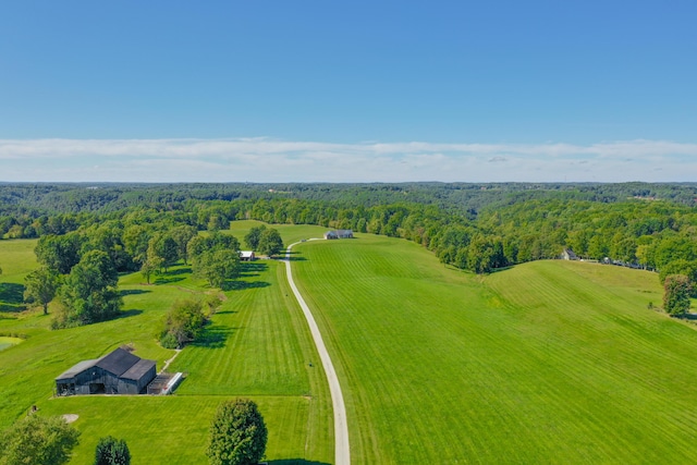 aerial view featuring a rural view and a view of trees