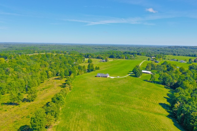 drone / aerial view featuring a rural view and a forest view