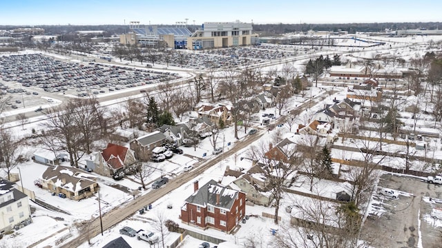 snowy aerial view featuring a residential view