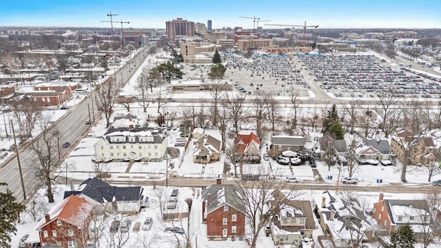 snowy aerial view featuring a residential view