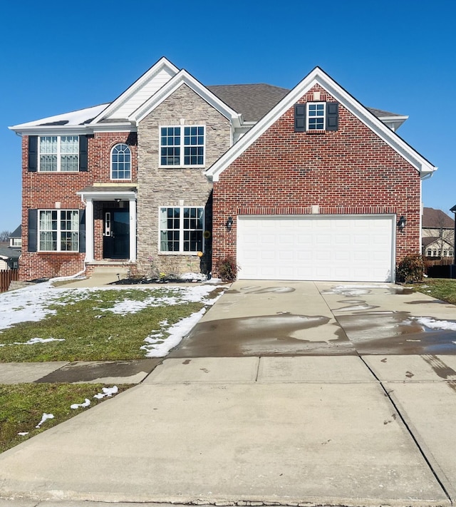 view of front facade featuring an attached garage, brick siding, fence, stone siding, and driveway