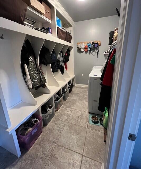 mudroom with washer and clothes dryer