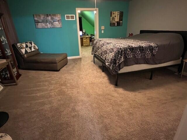 bedroom with carpet floors and visible vents