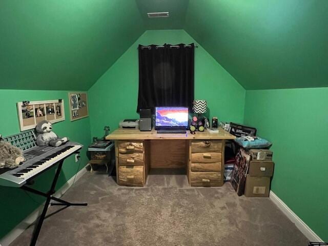 office with vaulted ceiling, carpet flooring, visible vents, and baseboards