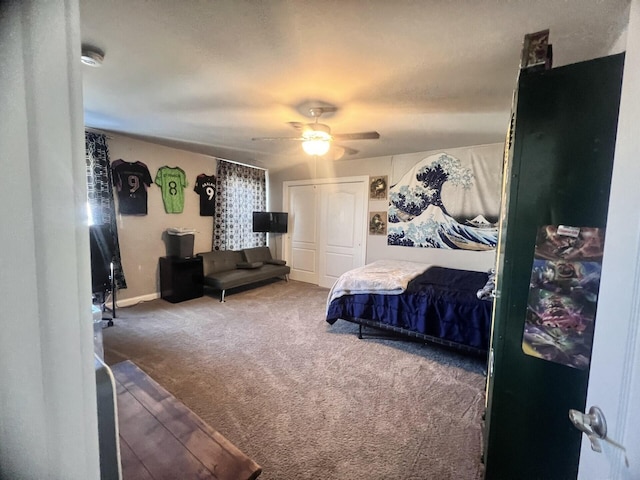 bedroom featuring a closet, carpet flooring, ceiling fan, and baseboards