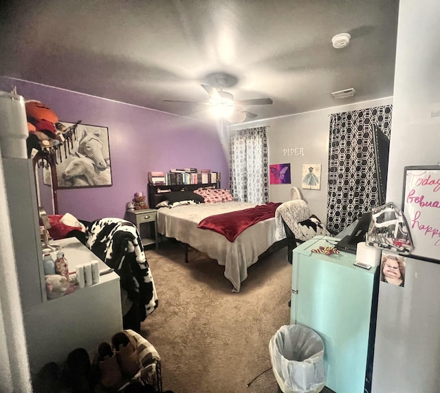 bedroom with carpet floors and a ceiling fan