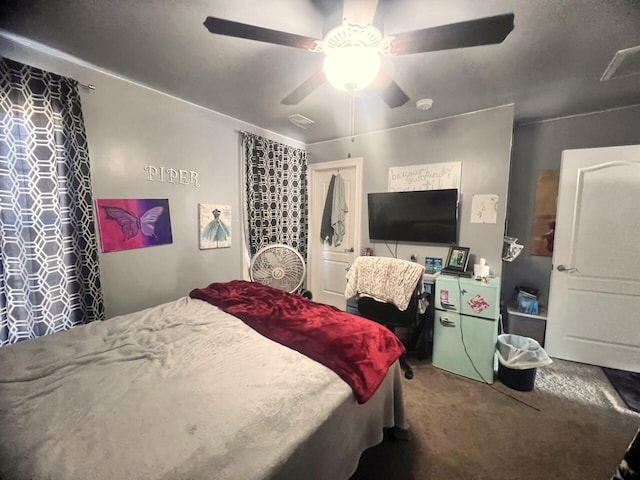 carpeted bedroom with a ceiling fan