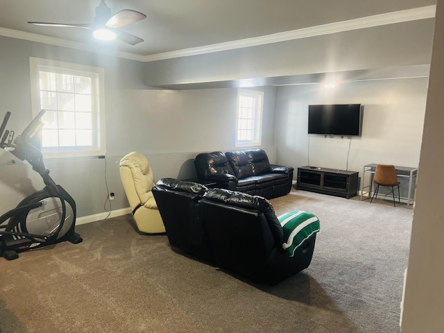 living area featuring carpet floors, ceiling fan, baseboards, and crown molding