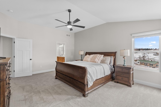 bedroom featuring visible vents, light colored carpet, baseboards, and lofted ceiling