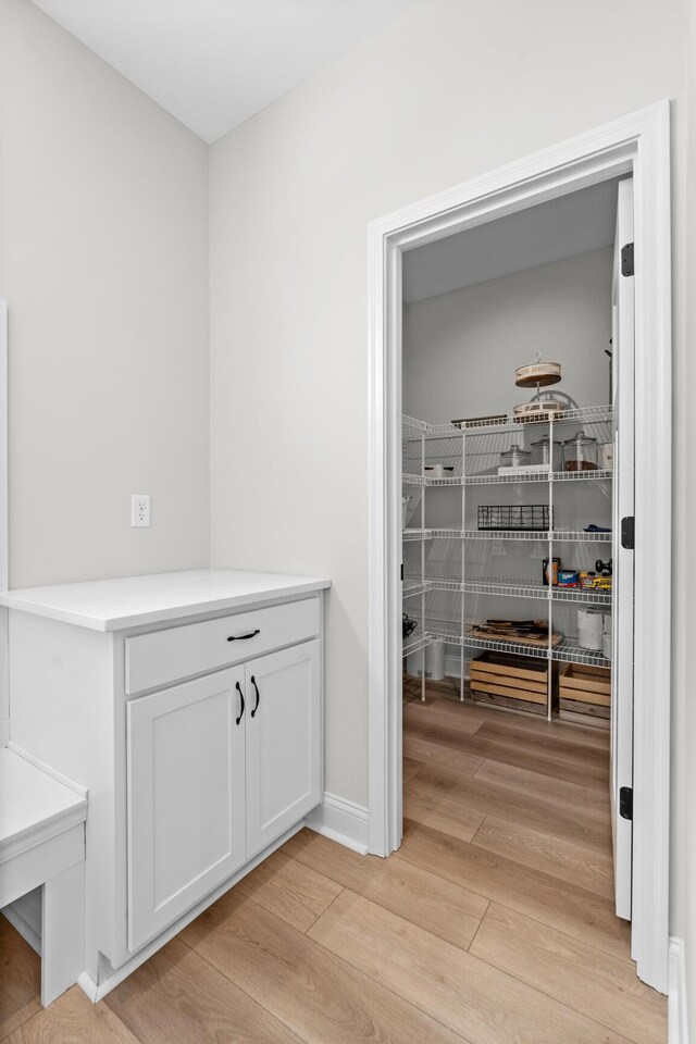 dining area with light wood-type flooring, baseboards, and recessed lighting