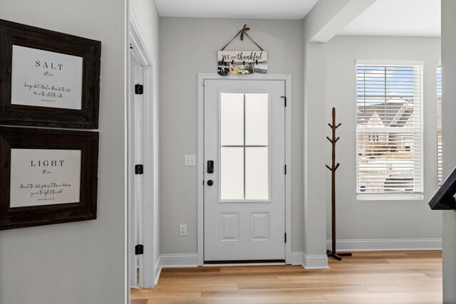 interior space with stairs, light wood finished floors, recessed lighting, and baseboards