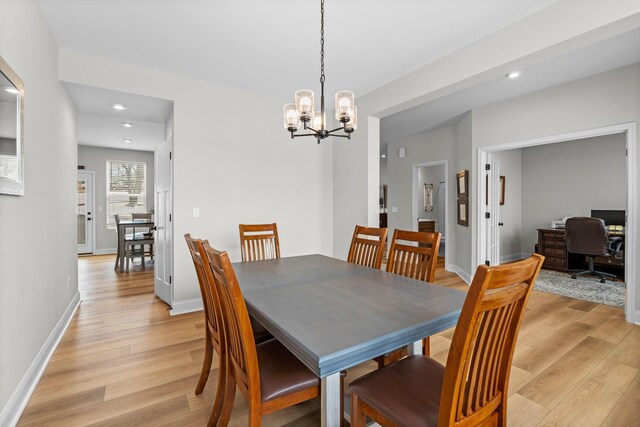 office with light wood-style floors and baseboards