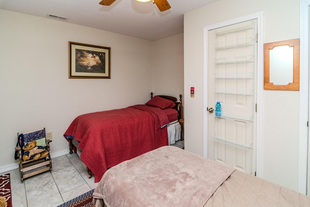 bedroom with marble finish floor, baseboards, visible vents, and a ceiling fan