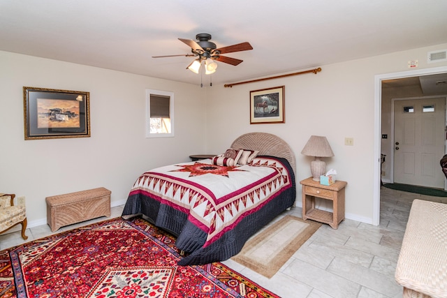 bedroom featuring a ceiling fan and baseboards