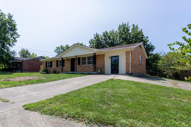 ranch-style house featuring a front lawn, concrete driveway, and brick siding