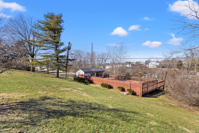 view of yard featuring an outdoor structure and a wooden deck