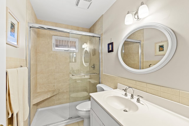 full bath with tile patterned flooring, toilet, vanity, visible vents, and a shower stall