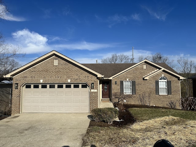 single story home featuring a garage, a shingled roof, concrete driveway, and brick siding