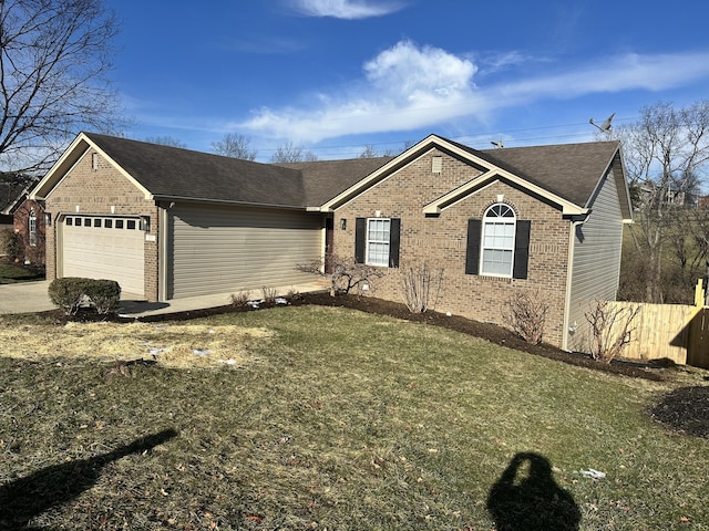 ranch-style home featuring a garage, driveway, a front yard, and brick siding