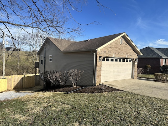 view of property exterior featuring brick siding, a yard, concrete driveway, fence, and a garage