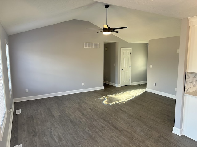 spare room with ceiling fan, baseboards, visible vents, and dark wood finished floors