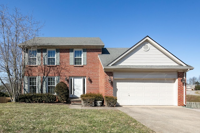 colonial-style house with brick siding, roof with shingles, an attached garage, a front yard, and driveway