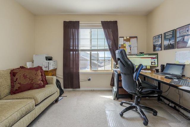 office featuring light carpet and baseboards