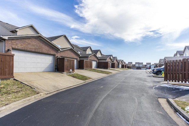 view of street with a residential view and curbs