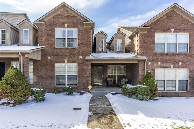 traditional-style home featuring brick siding