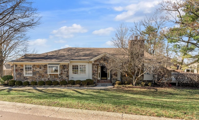 single story home with stone siding, a chimney, and a front lawn