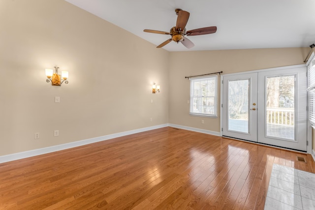 1649 Silver Pheasant Cir, Lexington, KY 40511 - spare room featuring a ceiling fan, lofted ceiling, french doors, light wood finished floors, and baseboards