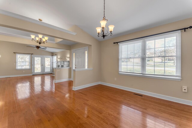 1649 Silver Pheasant Cir, Lexington, KY 40511 - unfurnished room featuring light wood-type flooring, an inviting chandelier, vaulted ceiling, and a wealth of natural light