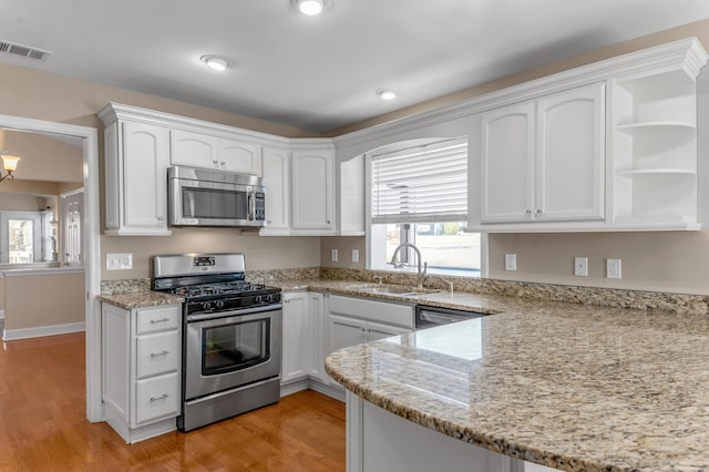 1649 Silver Pheasant Cir, Lexington, KY 40511 - kitchen featuring a sink, white cabinets, and stainless steel appliances