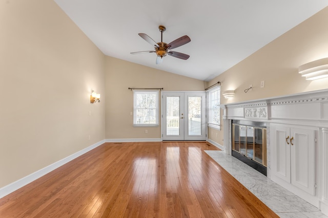 1649 Silver Pheasant Cir, Lexington, KY 40511 - unfurnished living room featuring a ceiling fan, lofted ceiling, a tile fireplace, light wood finished floors, and baseboards