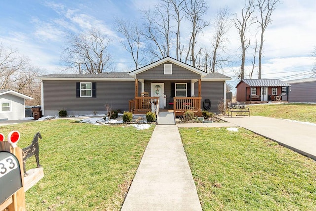 bungalow featuring a porch and a front yard