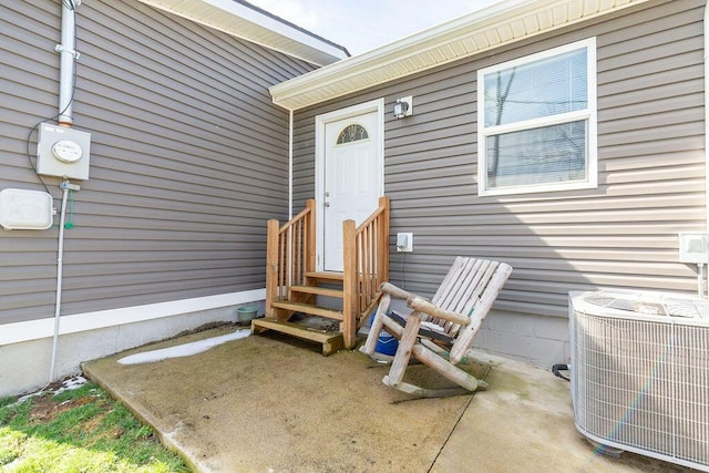 entrance to property featuring central AC unit