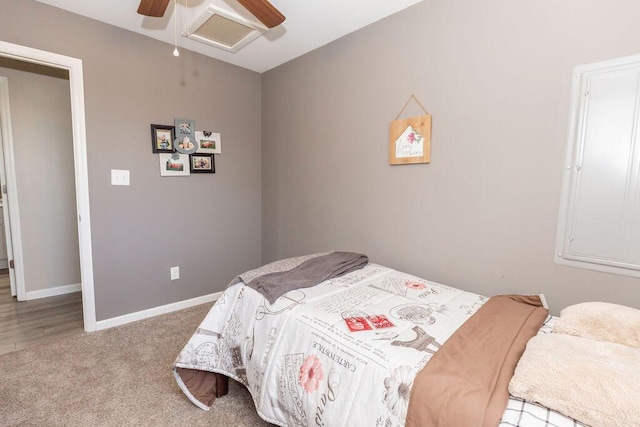 carpeted bedroom featuring a ceiling fan and baseboards