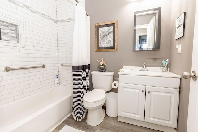 bathroom with toilet, shower / tub combo, wood finished floors, and vanity