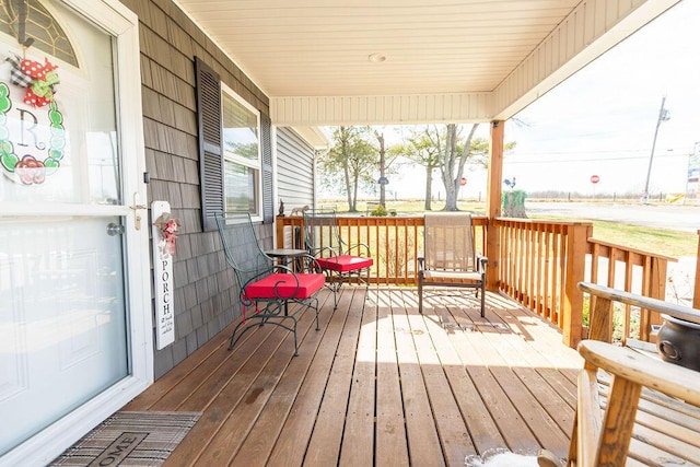 wooden terrace with a porch