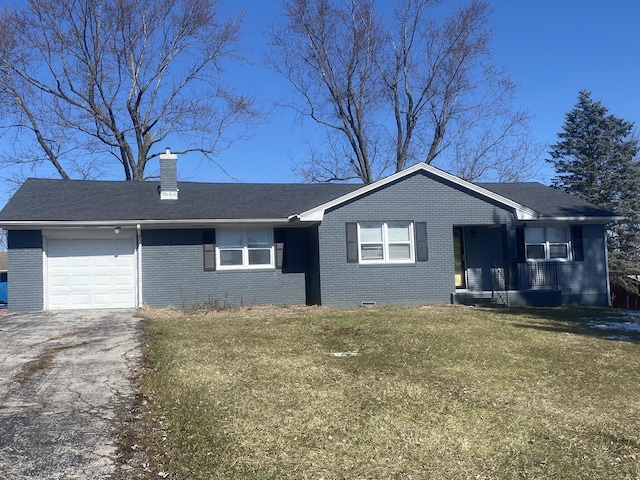 single story home with an attached garage, a front yard, a chimney, and brick siding