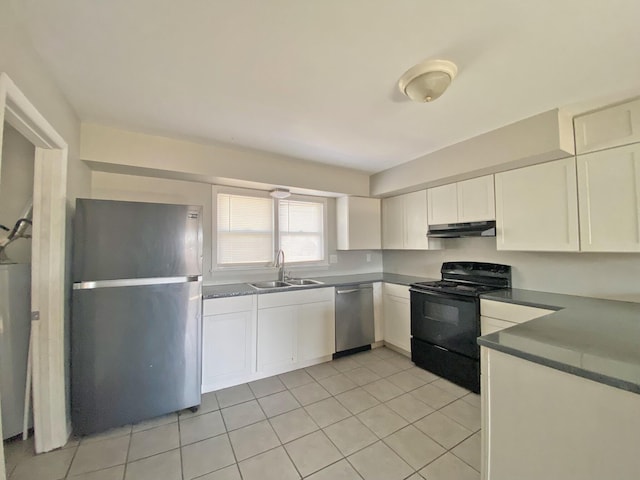 kitchen featuring appliances with stainless steel finishes, light tile patterned flooring, a sink, and under cabinet range hood