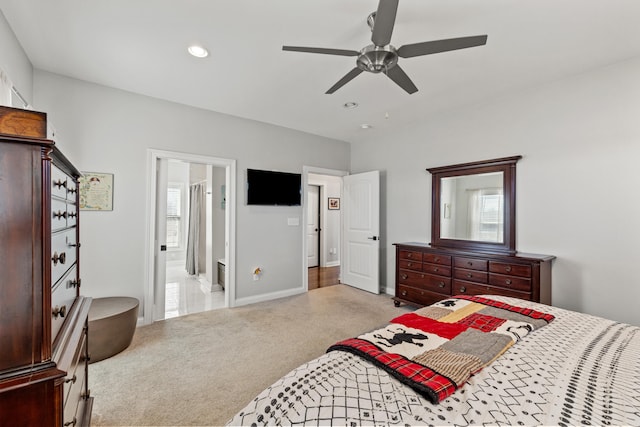 carpeted bedroom featuring baseboards, ensuite bath, a ceiling fan, and recessed lighting