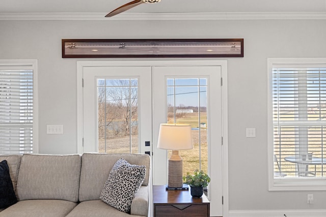 living area with ornamental molding